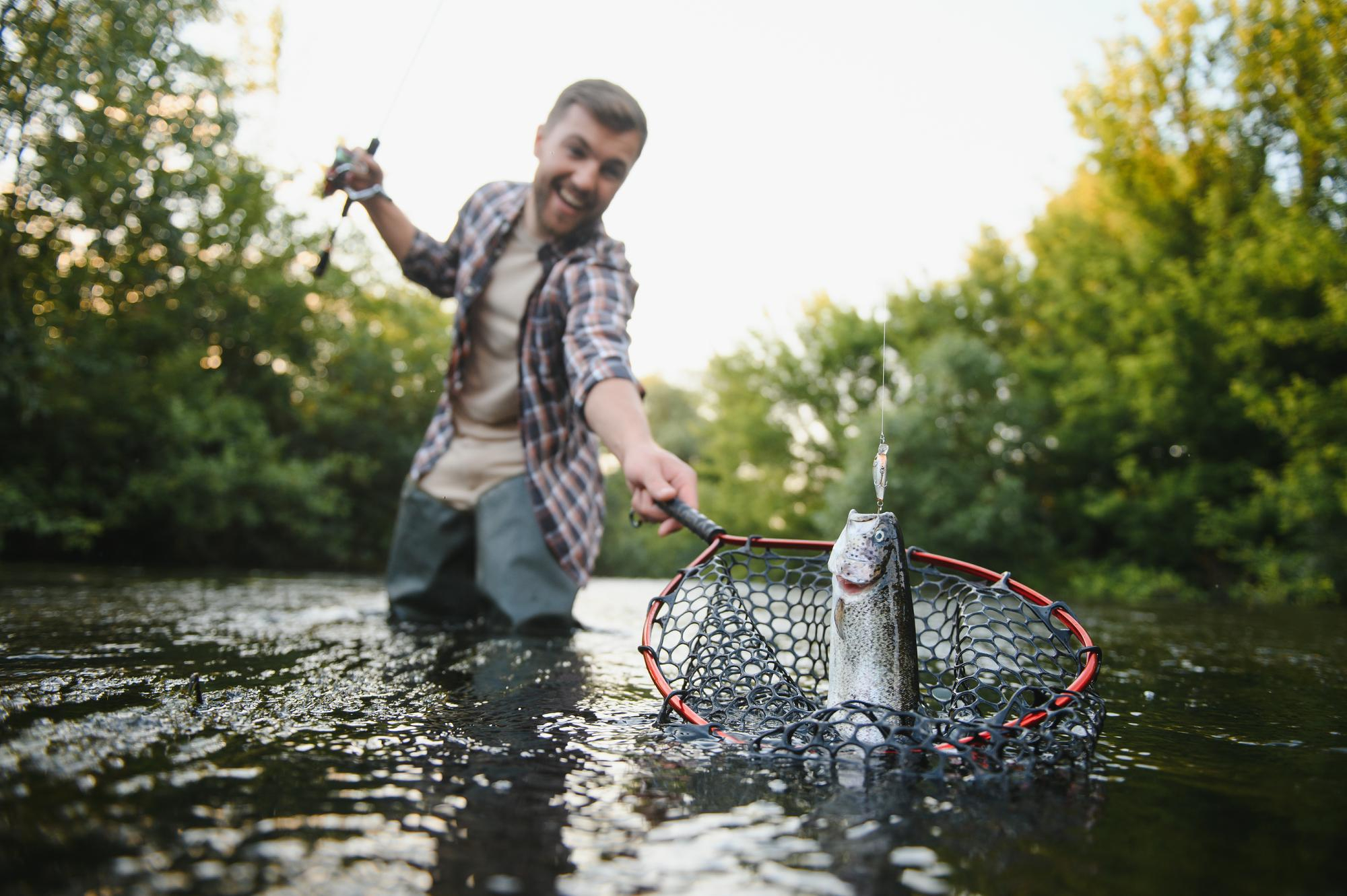 Best Fishing Scotland guide assisting a visiting angler