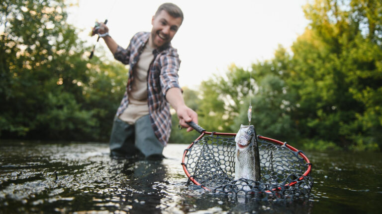 North American visitor enjoying a guided day on a Scottish river